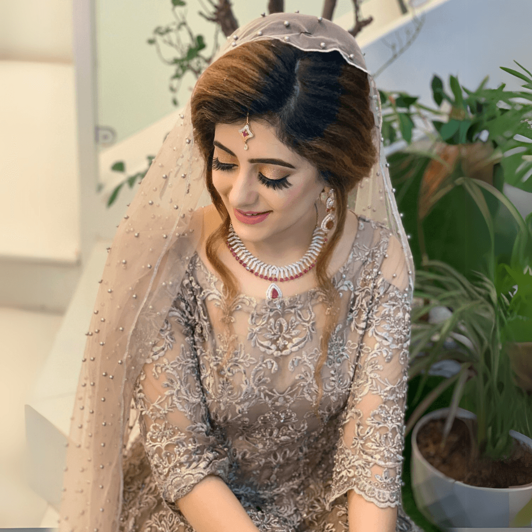 Soft bridal glam with beaded veil