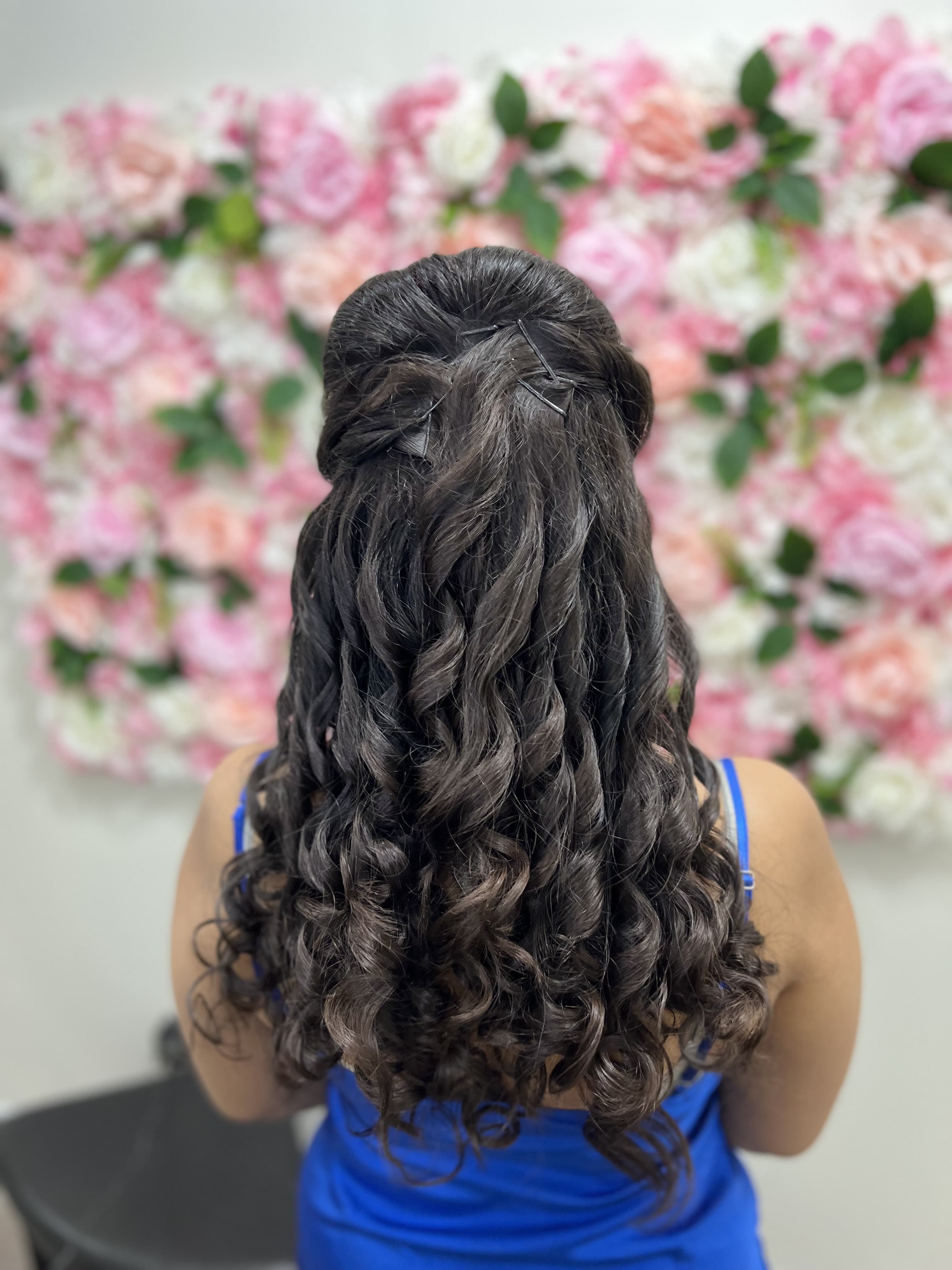 Half-up curls with waterfall braid